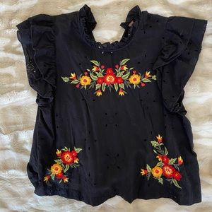 Free People black high neck, embroidered flowers.